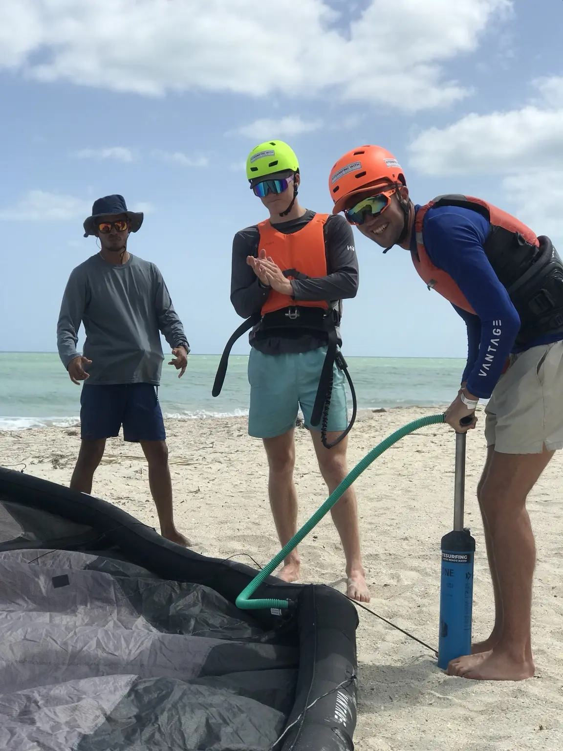 KiteAdventure instructor preparing equipment with students during a group introduction in Mayapo